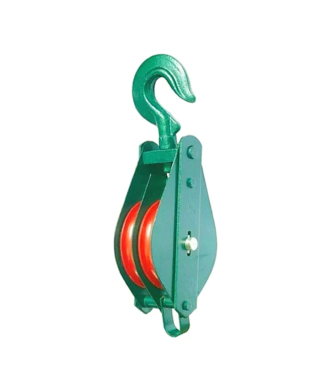 Green double-sheave pulley block with swivel hook and red wheels, isolated on white background