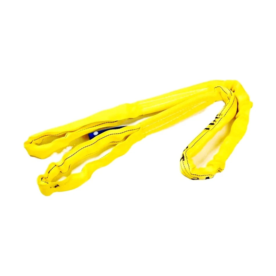 Yellow round lifting sling loosely coiled on a plain white background