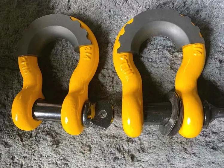Two yellow bow shackles