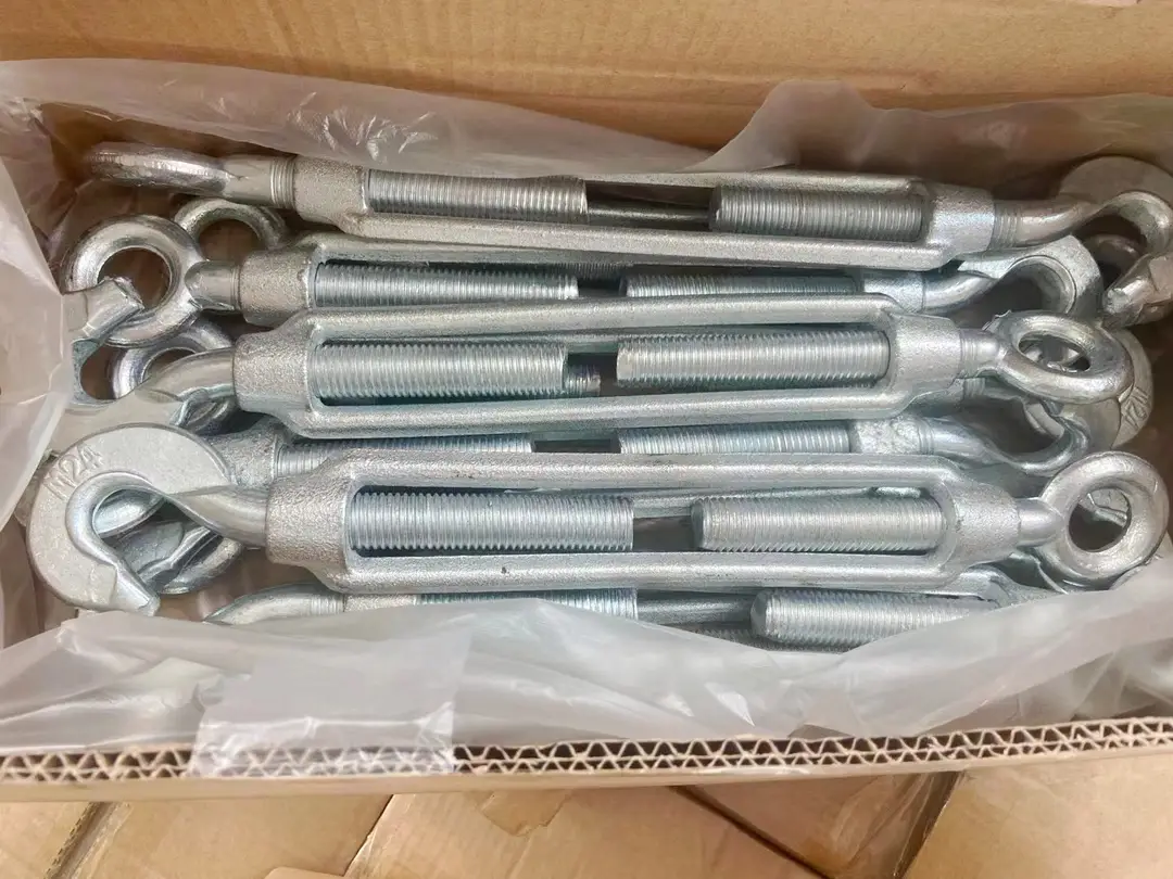 Galvanized steel turnbuckles with eye and hook ends packed in a cardboard box lined with plastic