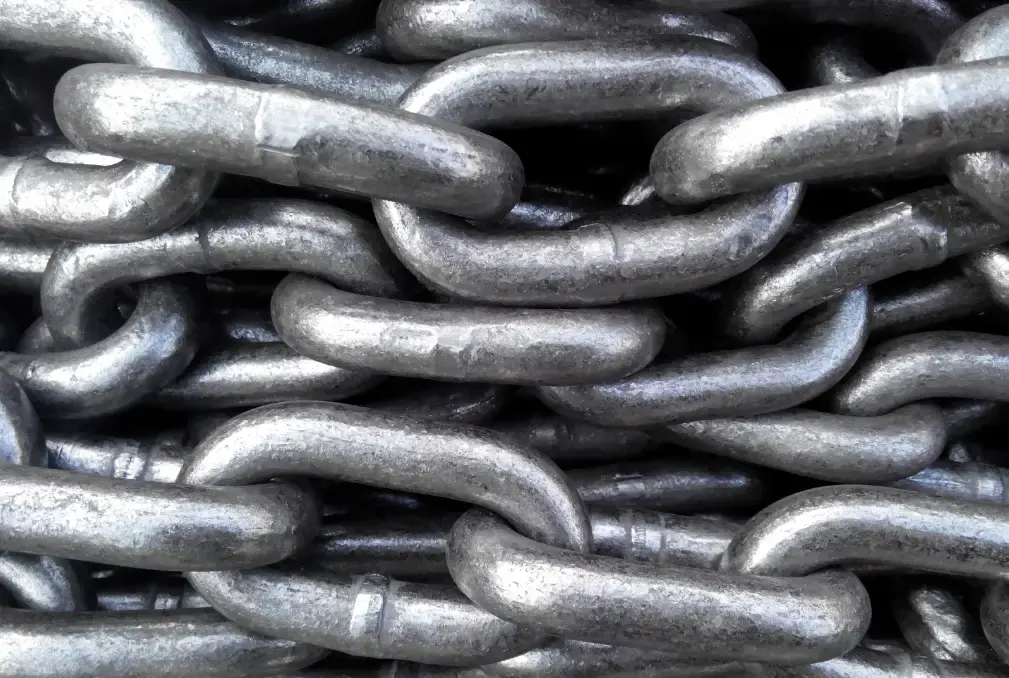 Close-up of interlinked galvanized steel chains with a metallic silver finish