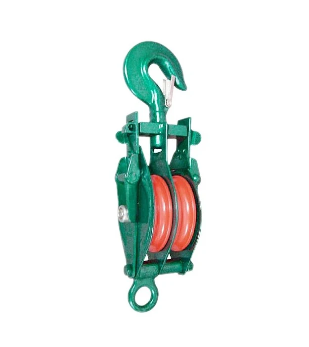 Green double-sheave pulley block with red wheels, top swivel hook and bottom eye ring, isolated on white