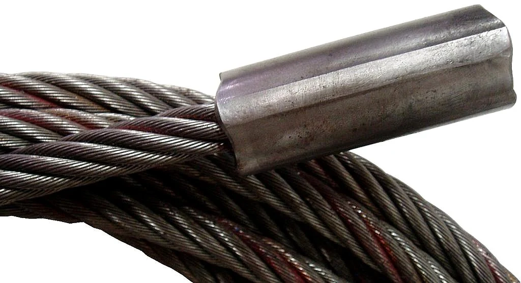 Steel wire rope strands with a crimped metal sleeve ferrule, close-up on a white background