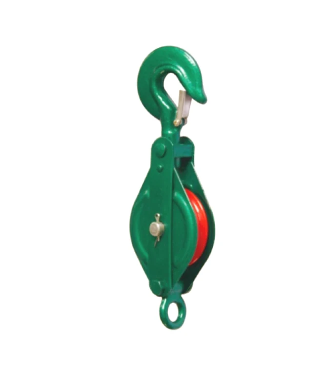 Green metal pulley block with swivel hook, red sheave, and bottom eye ring on white background