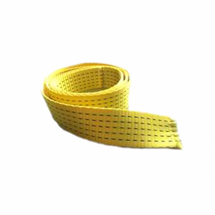 Coiled yellow woven webbing strap with slotted perforations along its length, on a white background