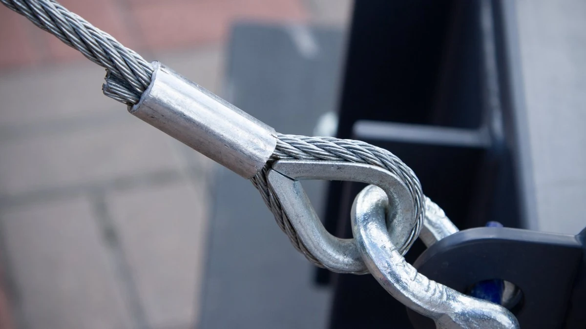Steel wire rope termination secured with swaged sleeve and thimble