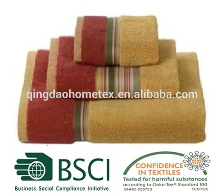 Stack of three folded towels in tan and burgundy with striped borders, BSCI and OEKO-TEX logos below