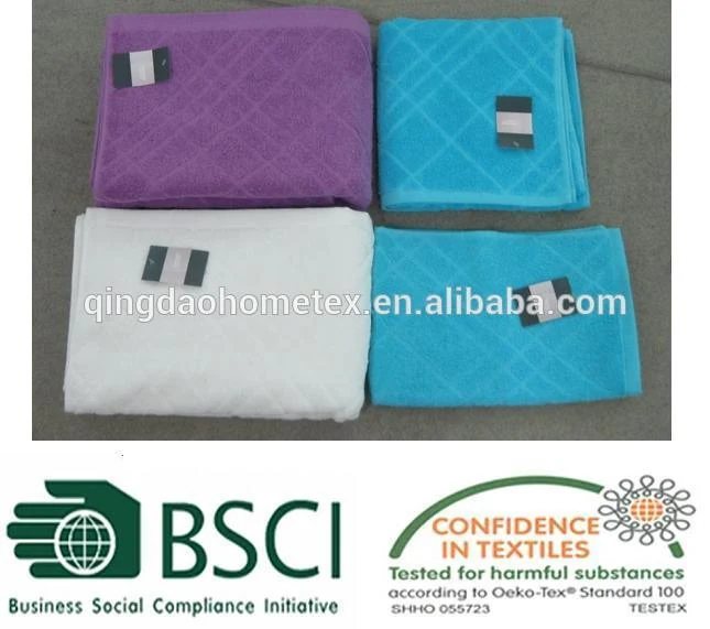 Four folded microfiber towels in purple, blue, and white with care labels, displayed with BSCI and OEKO-TEX certification logos.