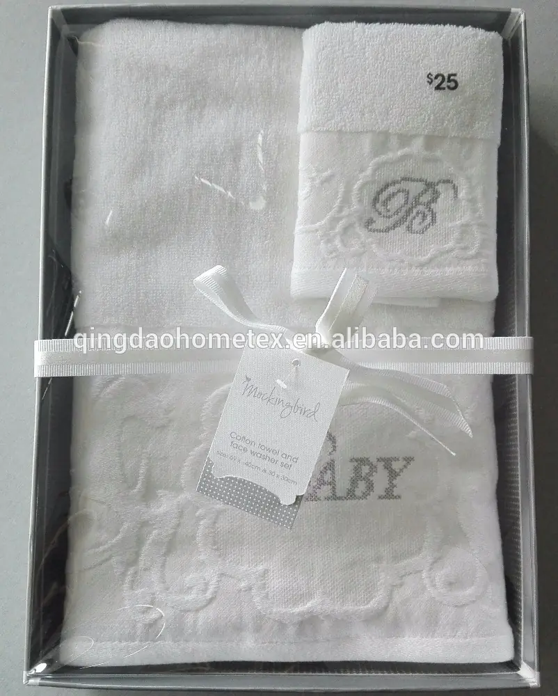 White embroidered baby towel set with ribbon and tag inside a gift box