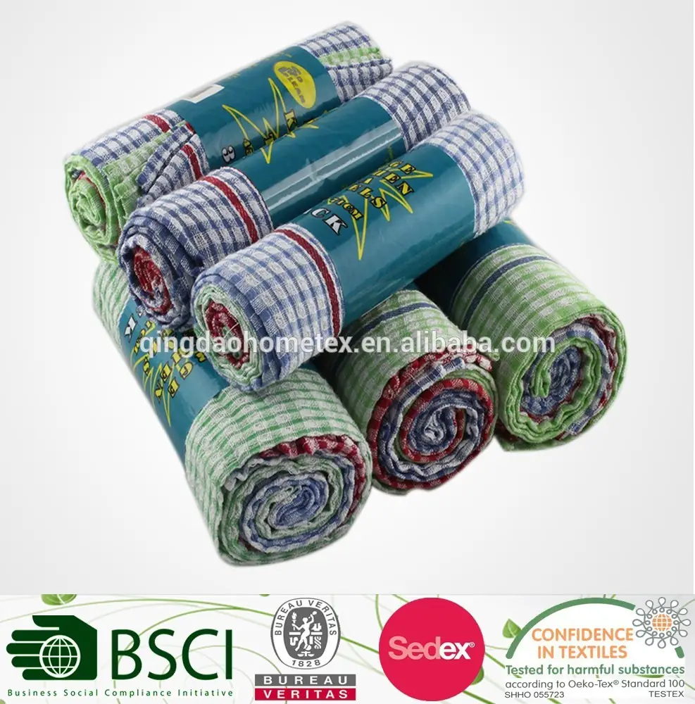Stack of rolled checkered kitchen towels in teal printed wrappers with certification logos along the bottom