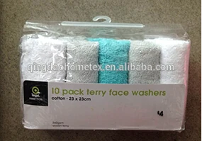 Packaged set of 10 terry face washers in white and turquoise colors.