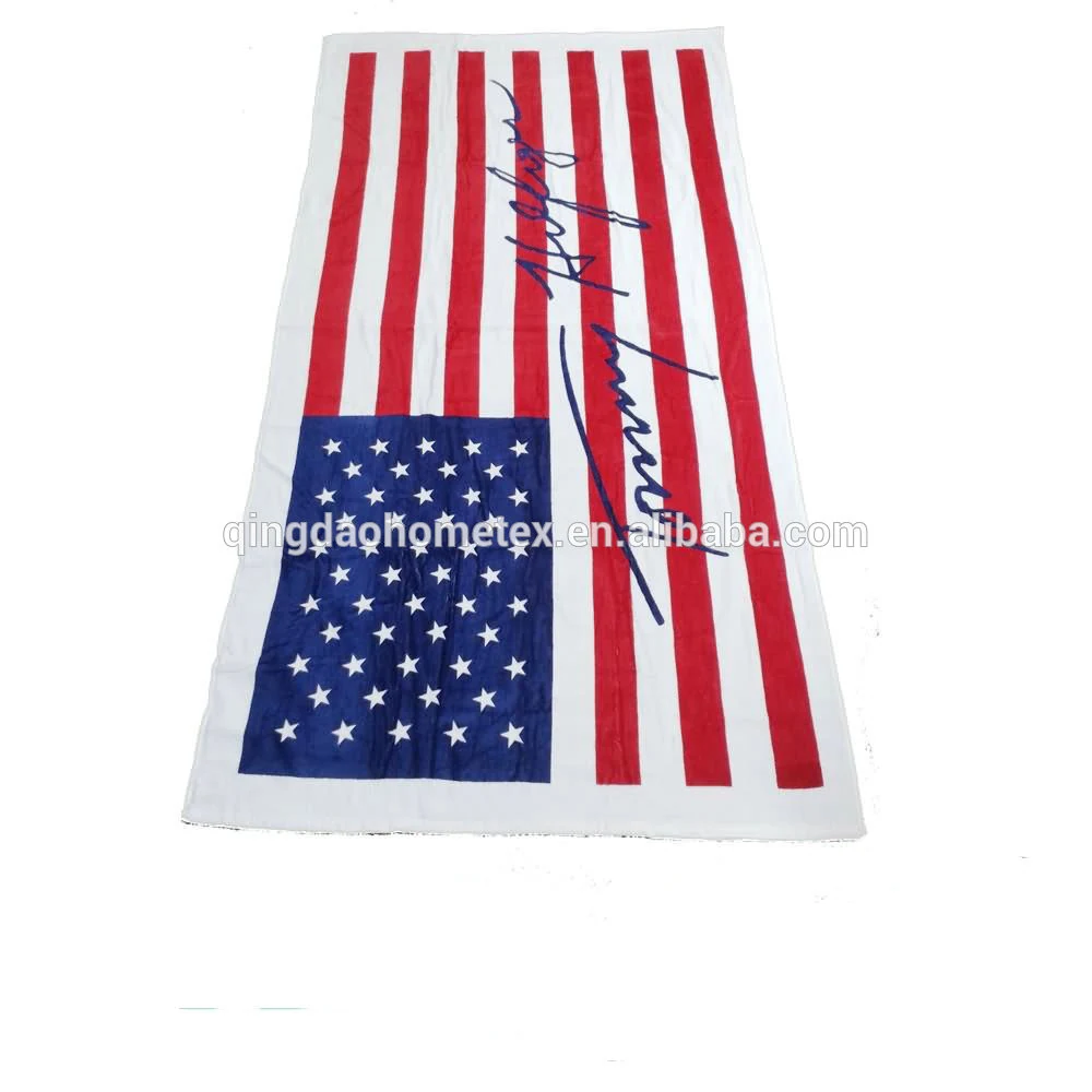 White beach towel featuring an American flag design with a signature graphic.