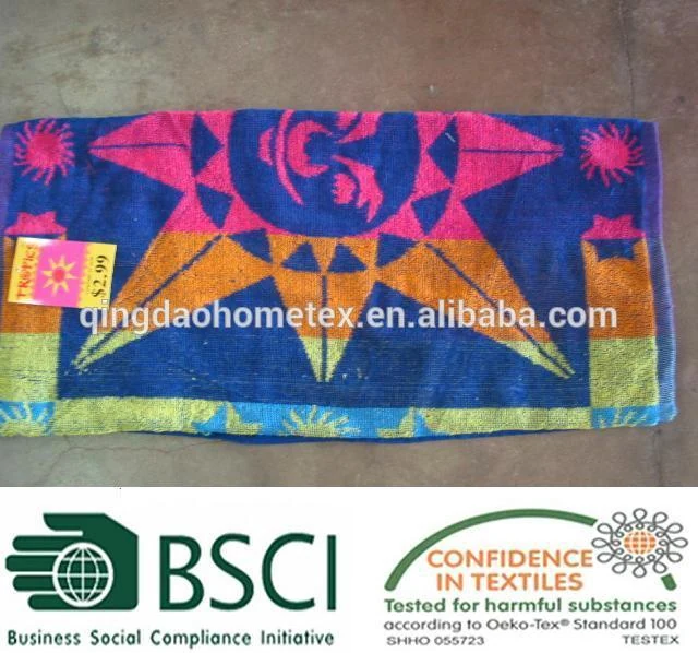 Colorful beach towel with geometric sun design and price tag, displayed with certification logos.