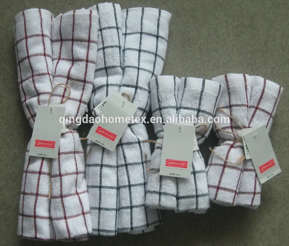 Five folded white kitchen towels with red and black grid patterns and attached tags.