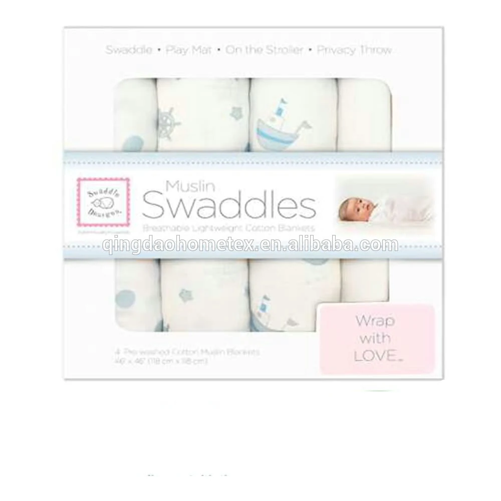 Packaged set of four white muslin swaddle blankets with blue nautical prints, labeled Muslin Swaddles, Wrap with LOVE