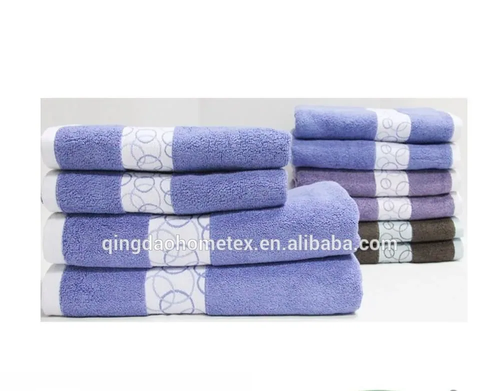 Stacks of folded towels in purple, lavender, and brown with white patterned bands, plus BSCI and Confidence in Textiles logos