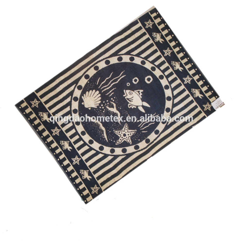 Navy blue and white striped beach towel with printed sea creatures, laid flat on white background