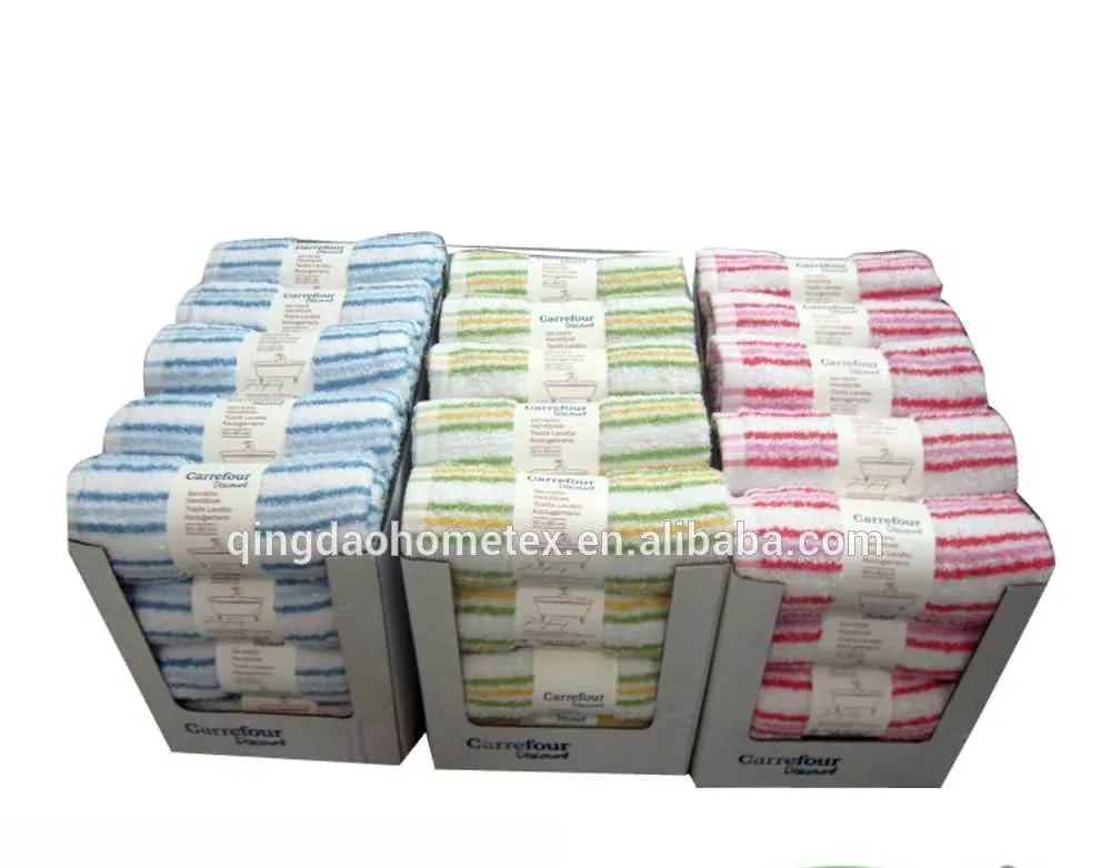 Cardboard counter displays of striped towels in blue, green, and pink, with BSCI and Confidence in Textiles logos below