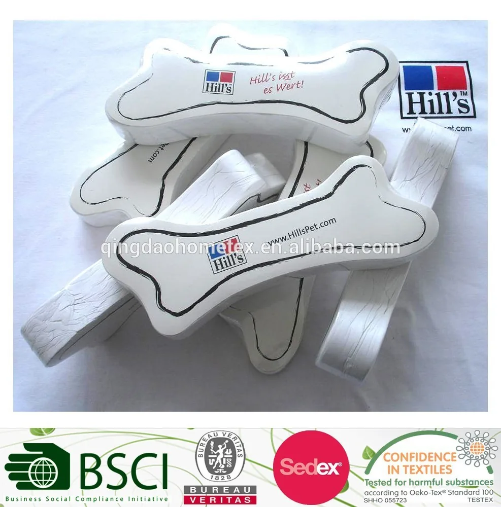 White bone-shaped textile items printed with Hill's logos and a website URL, with certification logos along the bottom