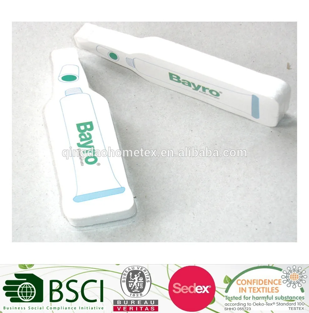 Two white printed bottle-shaped cushion items with green Bayro logo on a light surface