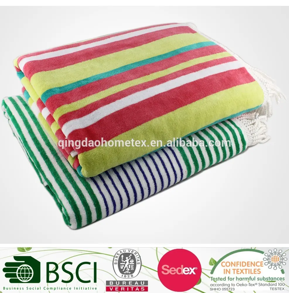 Two folded striped beach towels in green, pink, yellow, and teal on a white background with certification logos below.