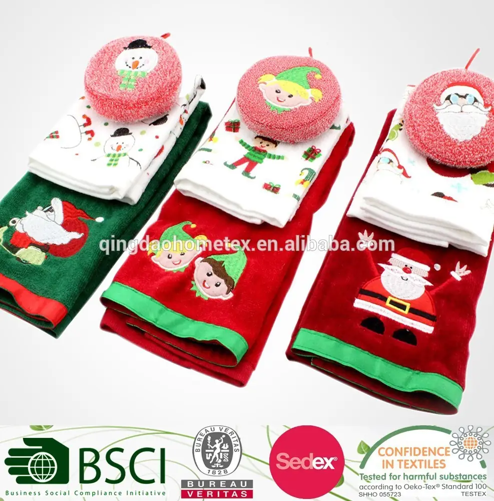 Christmas-themed embroidered towels and round face towels in red and green, folded in rows on a white background.