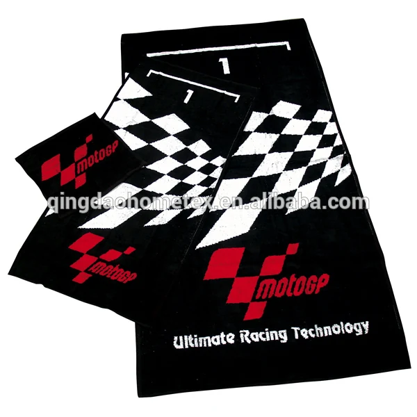 Black woven towels with checkered flag pattern and red racing logo, displayed on a plain background