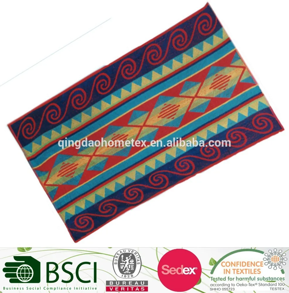 Colorful geometric-patterned woven textile rug with red, blue, and teal designs, tilted on white background