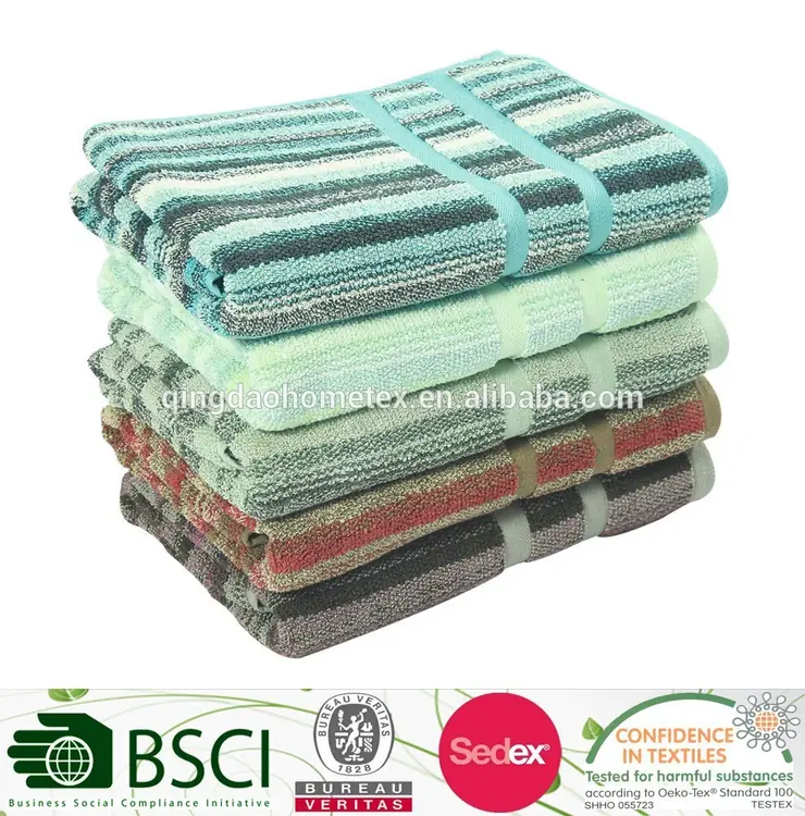 Stack of folded striped towels in teal, green, red, and brown on a white background