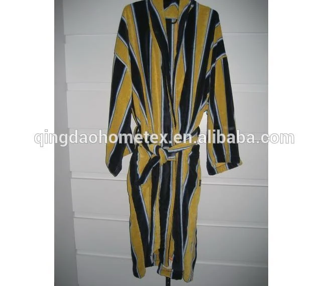 Yellow and black striped robe hanging against a white wall with a belt tie
