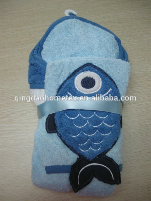 Folded blue fish-shaped children's hooded towel with embroidered fish design, tied with a satin ribbon