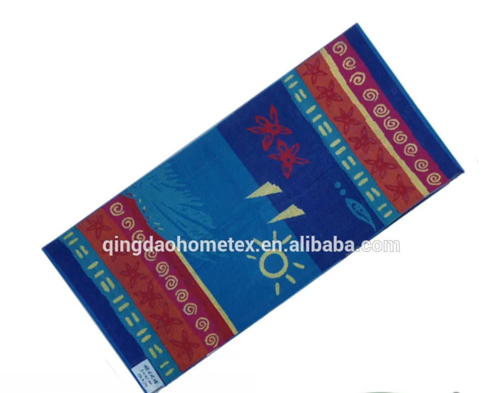 Colorful blue beach towel with sun and floral patterns, shown diagonally on white background with BSCI and Oeko-Tex logos below