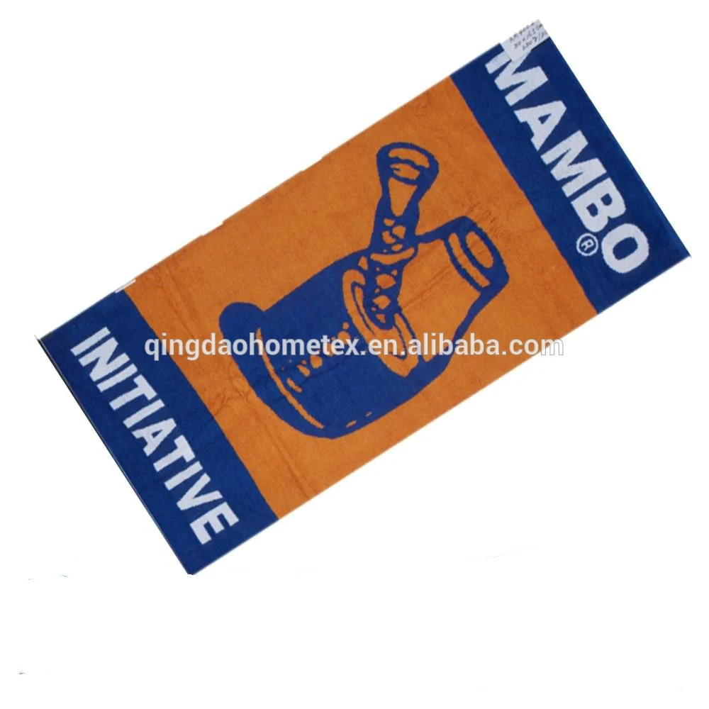 Orange and navy printed beach towel with MAMBO INITIATIVE graphics, tilted on white background