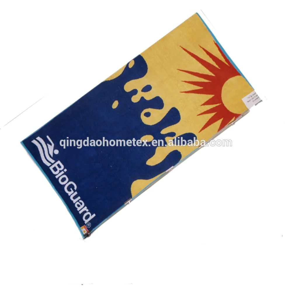 Beach towel with blue, yellow, and red sun and splash design, white text logo near one corner