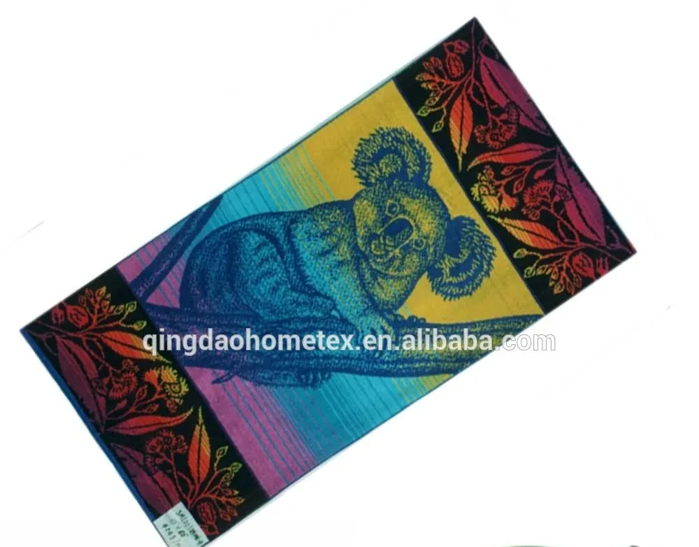 Colorful printed beach towel with a koala design, shown diagonally with BSCI and Oeko-Tex certification logos overlaid
