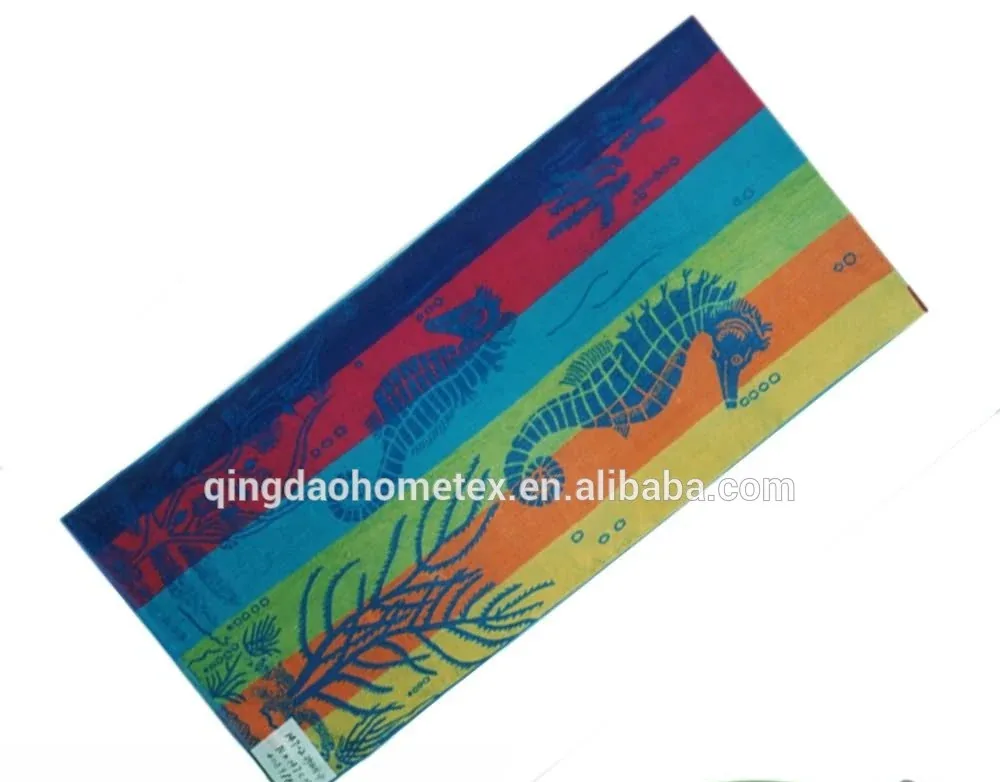 Colorful striped beach towel with seahorse and seaweed prints shown diagonally, with BSCI and Oeko-Tex certification logos below