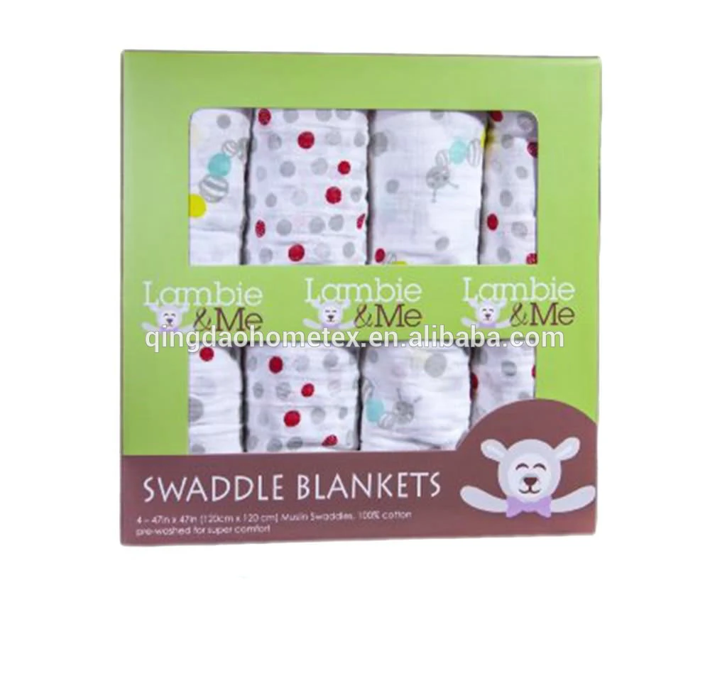 Boxed set of four patterned cotton swaddle blankets with green retail packaging