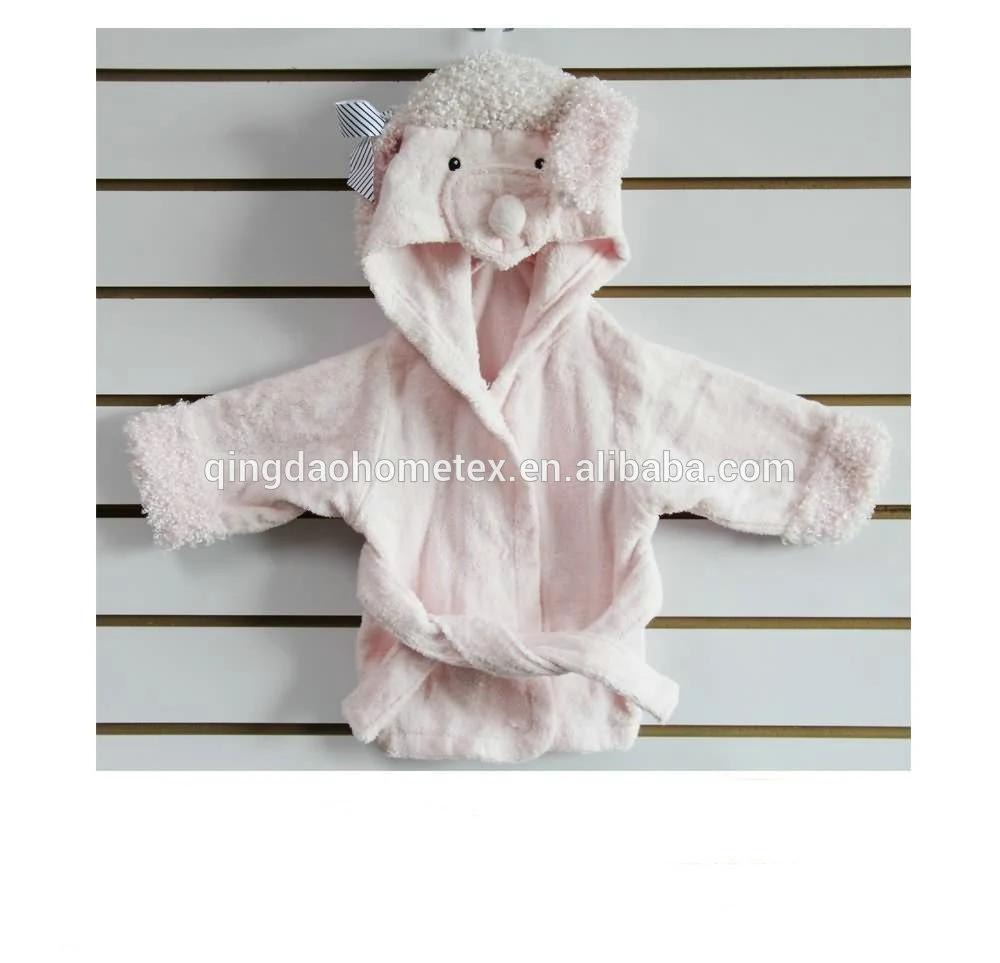 Pink hooded baby bathrobe with animal face design and fluffy trim, hanging on a slatwall display