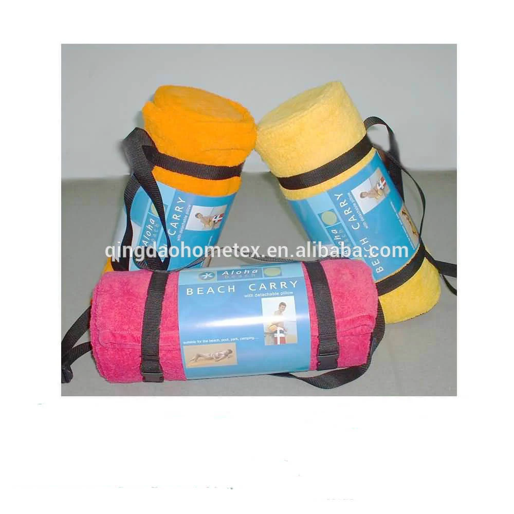 Three rolled beach towels in orange, yellow, and pink with black carry straps and blue 'Beach Carry' packaging bands