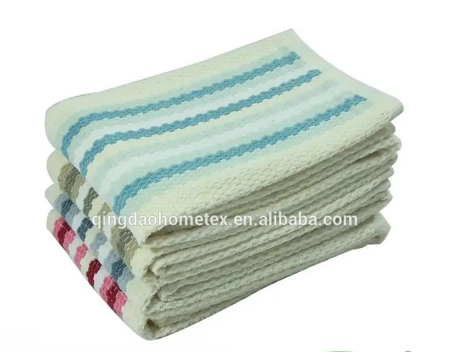 Stack of folded striped kitchen towels in cream, blue, and multicolor designs on a white background