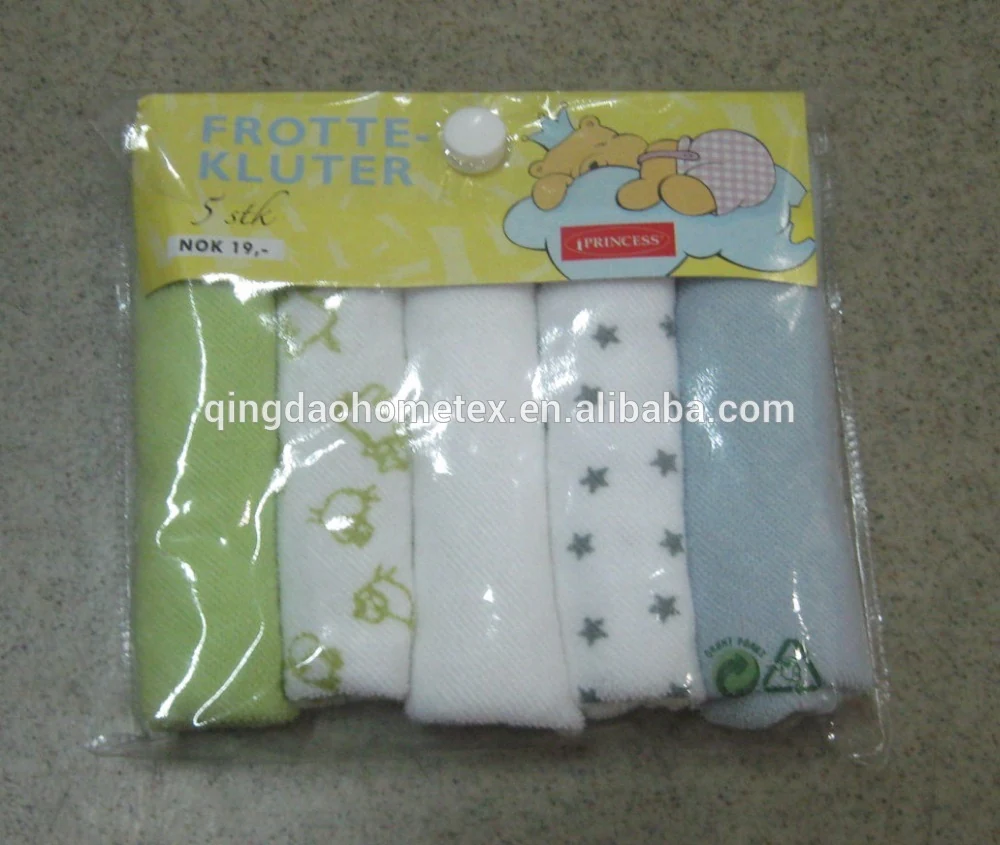 Pack of five baby washcloths in green, white with duck print, white, star print, and blue, in plastic packaging with yellow header card