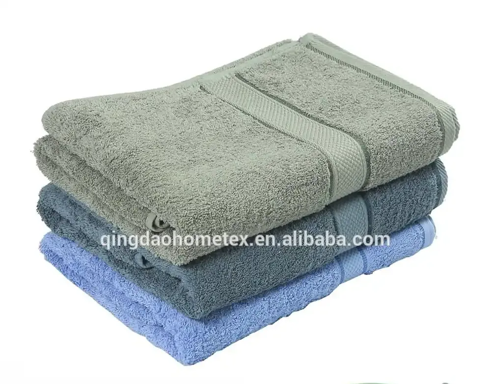 Stack of three folded towels in sage green, gray-blue, and light blue with BSCI and Confidence in Textiles certification logos below