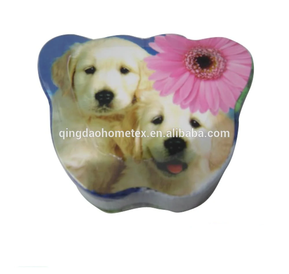 Bear-shaped tin container decorated with a printed image of golden retriever puppies and a pink gerbera flower, on a white background