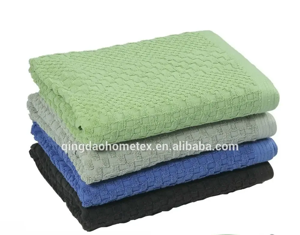 Stack of four folded waffle-weave towels in green, gray, blue, and black with BSCI and Oeko-Tex logos below