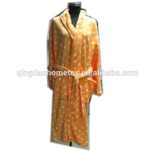 Orange coral fleece bathrobe with white polka dots on a black mannequin, belted, against white background