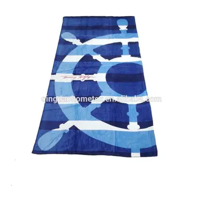 Blue and white striped beach towel with a nautical ship's wheel