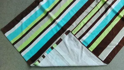 Striped towel in brown, turquoise, green and white