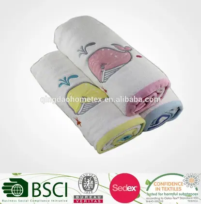White 100% cotton dobby children's bath towel, 50x100 cm, with subtle textured weave, laid flat