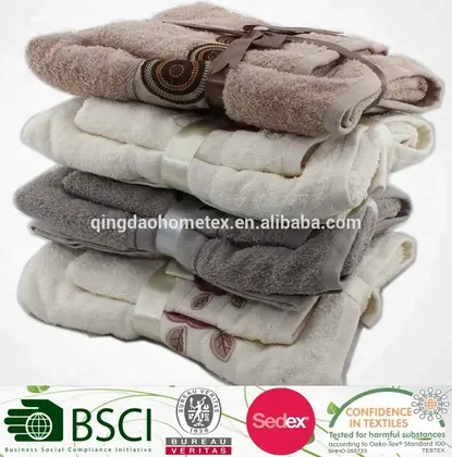 Stack of folded terry towels in beige, brown