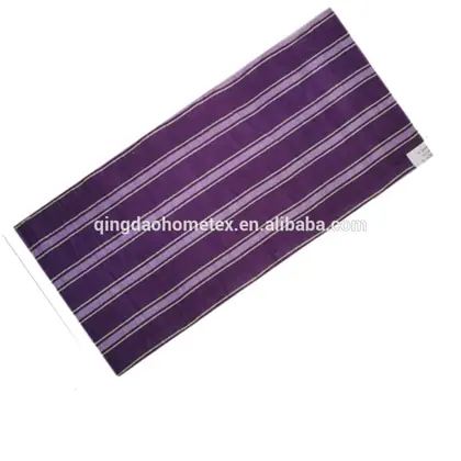 Purple striped towel with lavender and white stripes laid diagonally on a plain white background